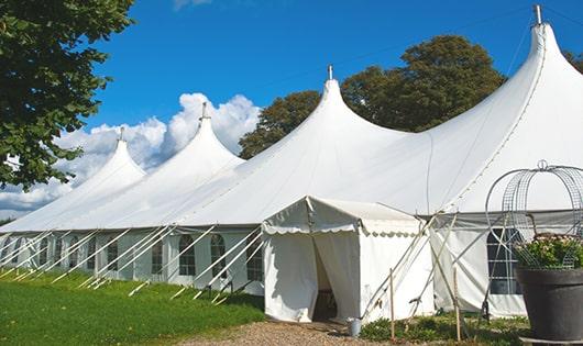 multiple portable restrooms in a row for added convenience at a concert venue in Glencoe